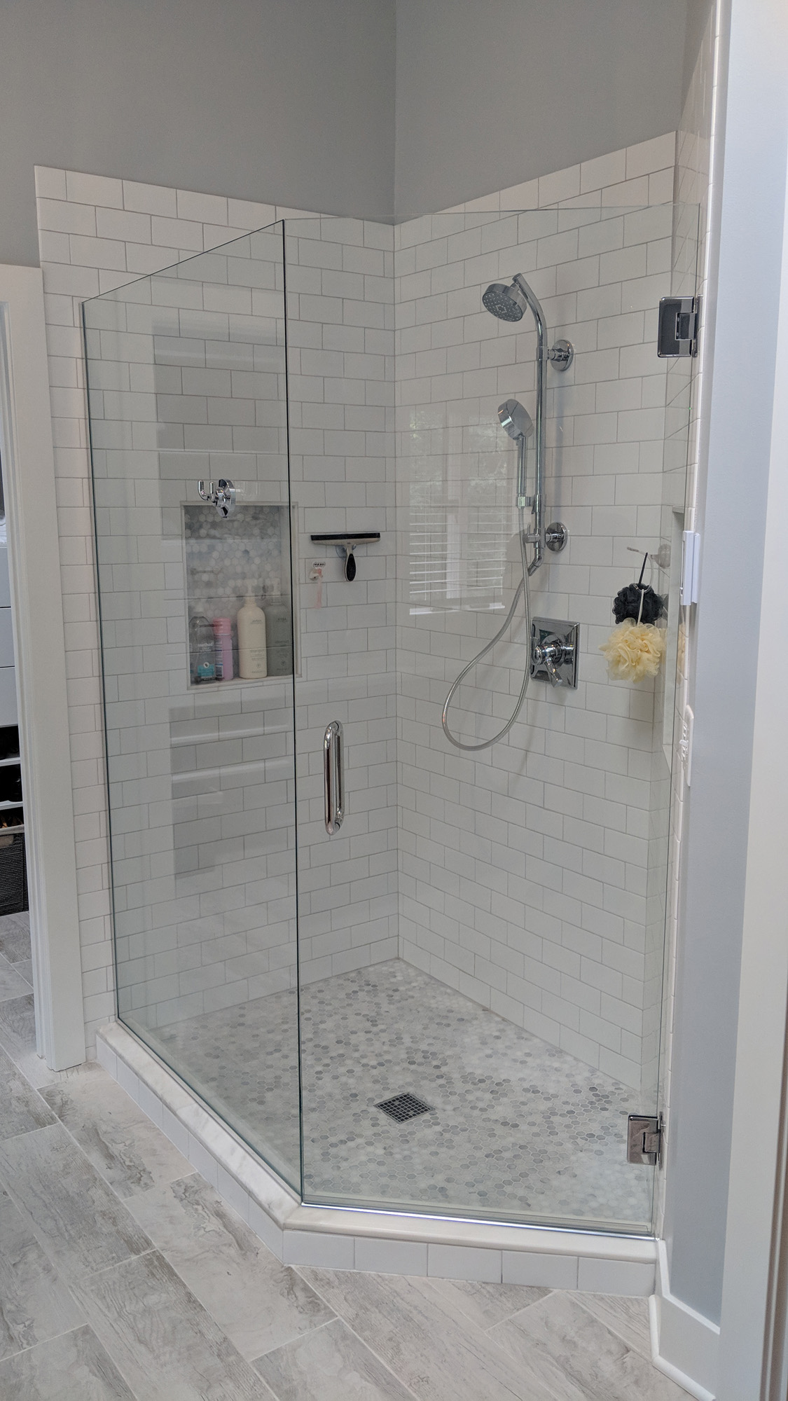 Open frameless glass enclosed shower