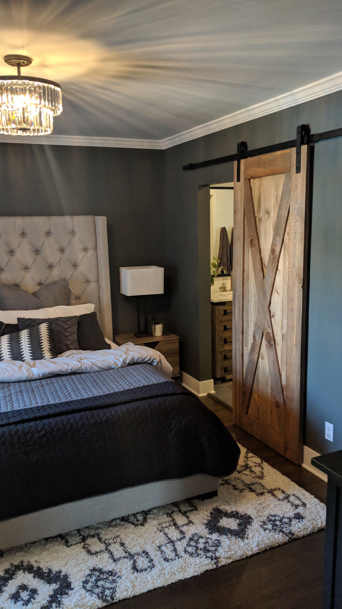 Master bedroom with barn door to master bath