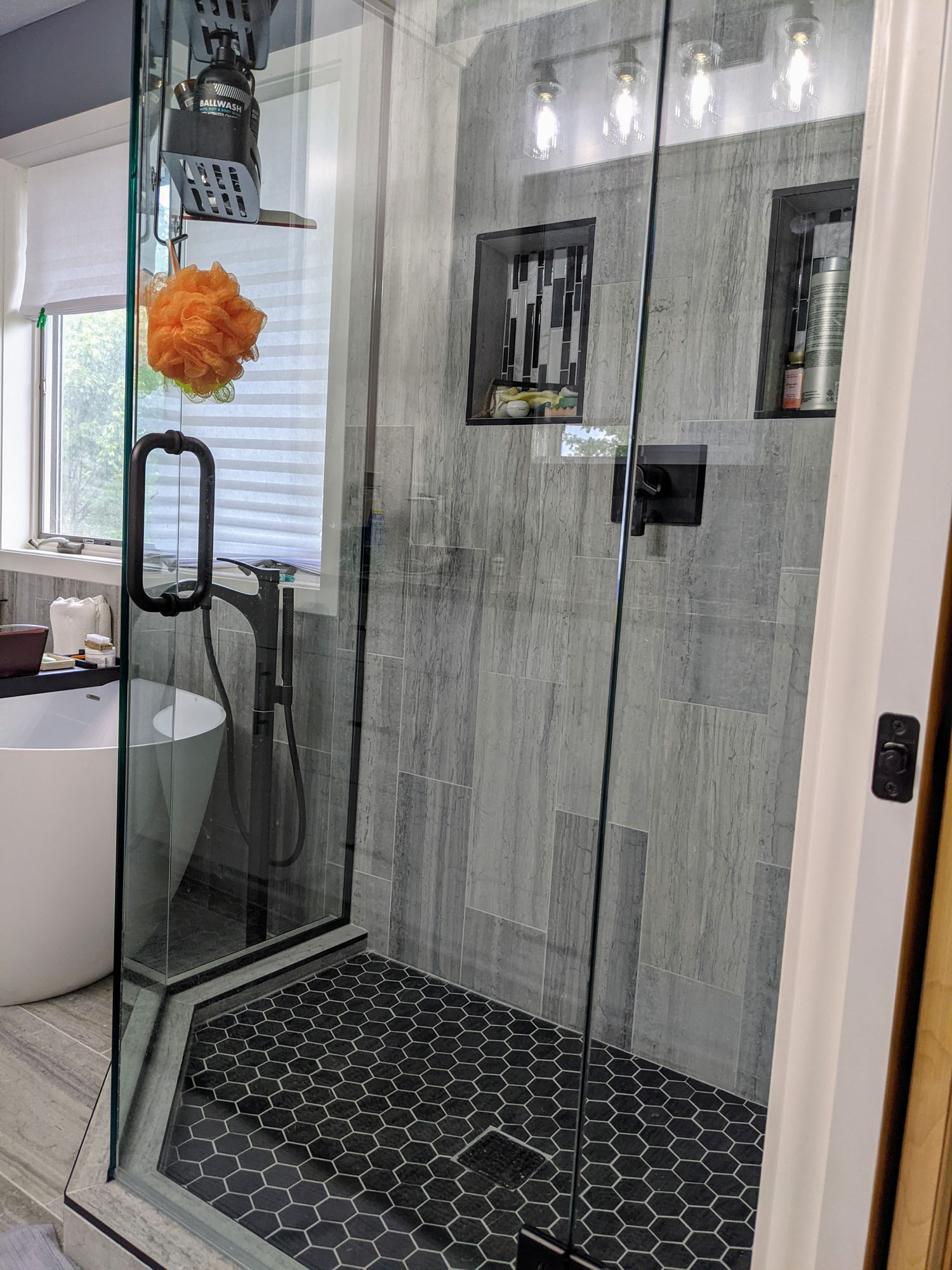 Glass door and wall tile shower