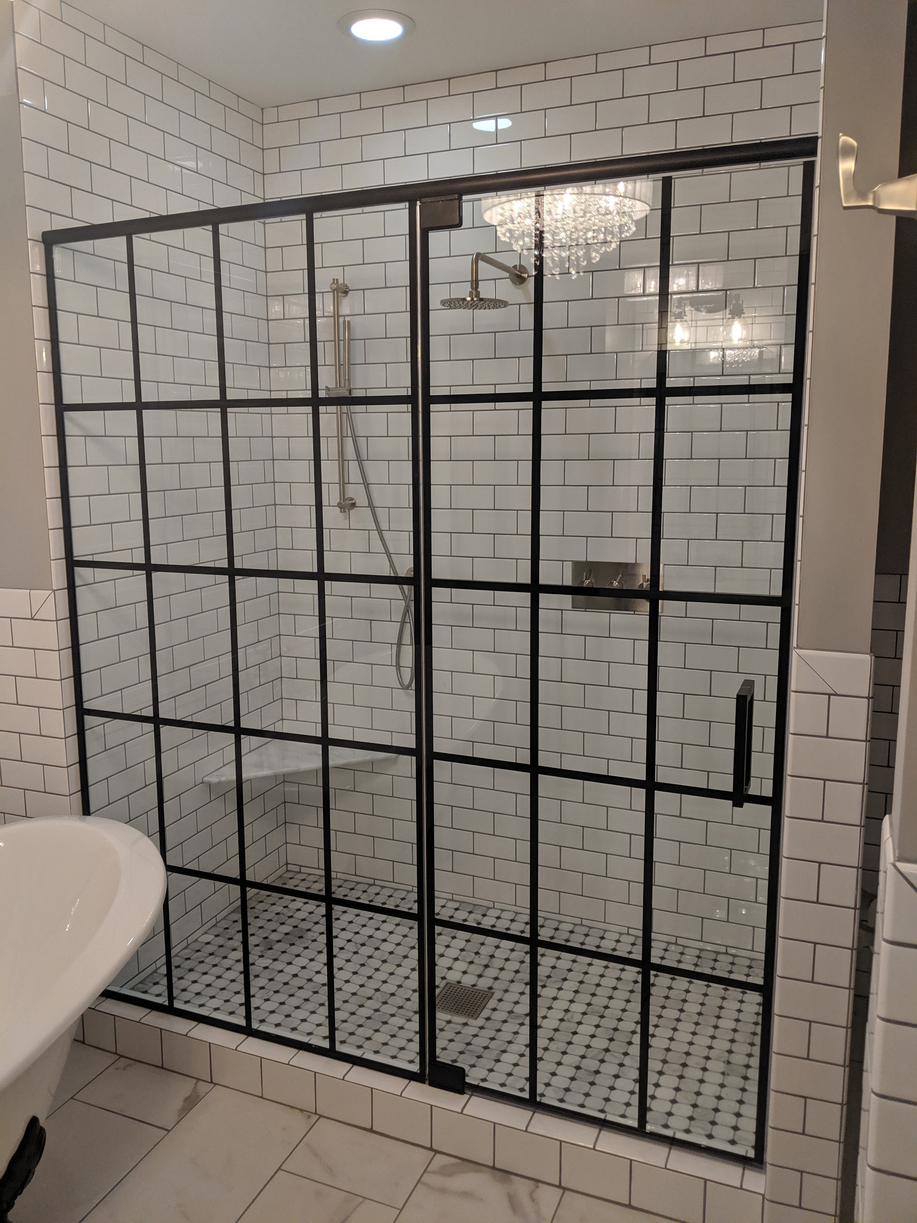 Custom gridded heavy shower enclosure w/ black hardware