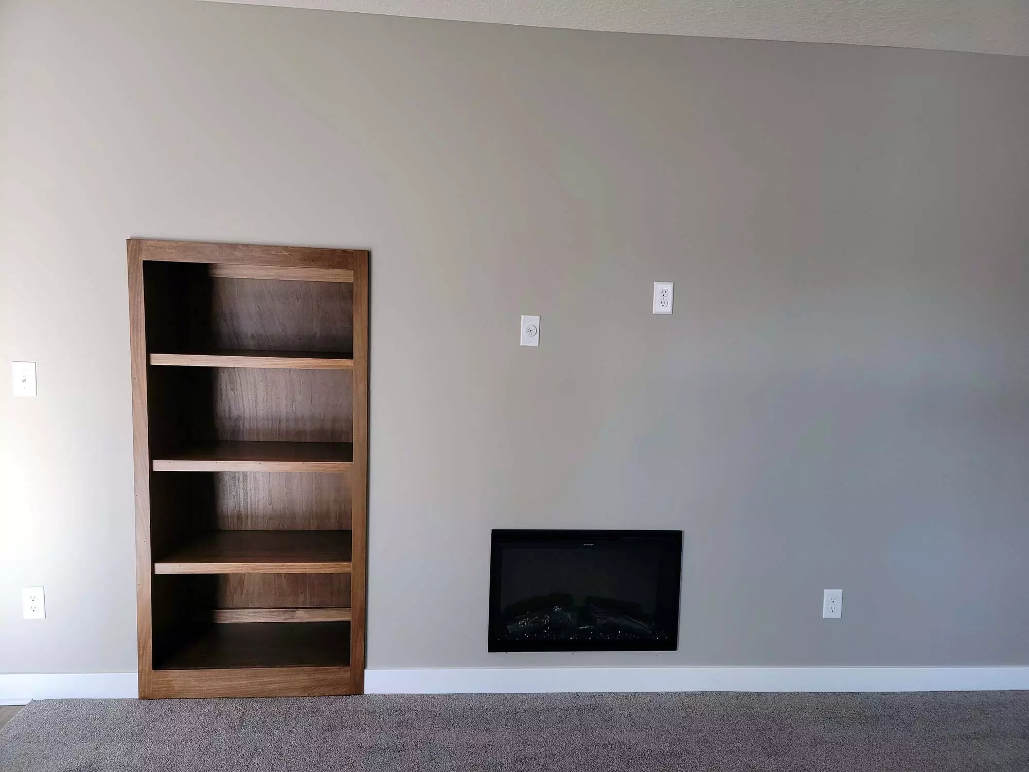 Media wall with Fireplace and bookcase