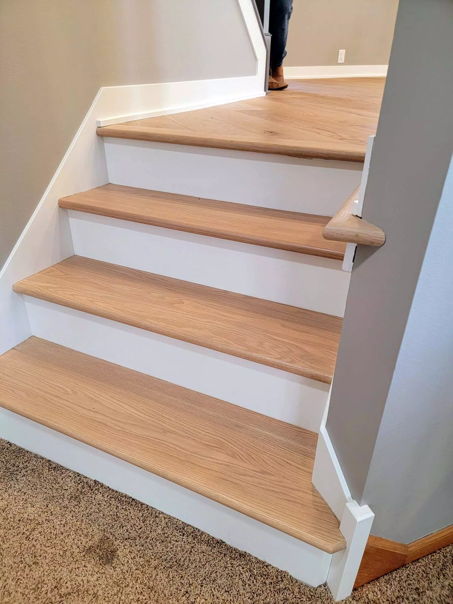 Solid Red Oak stair treads, custom matched to prefinished floors