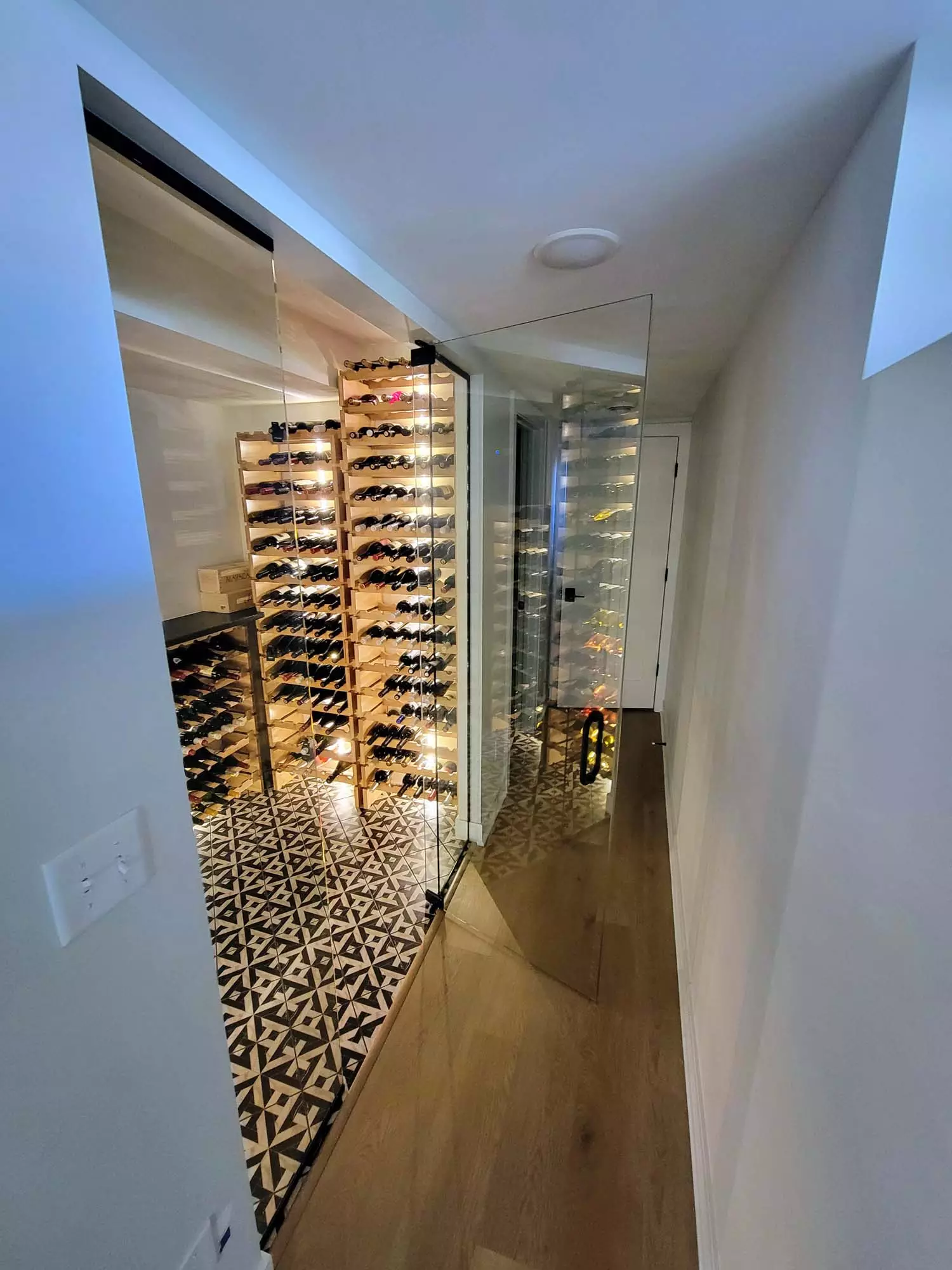 Walk-In-Wine Cellar with heavy ½″ glass panels & door