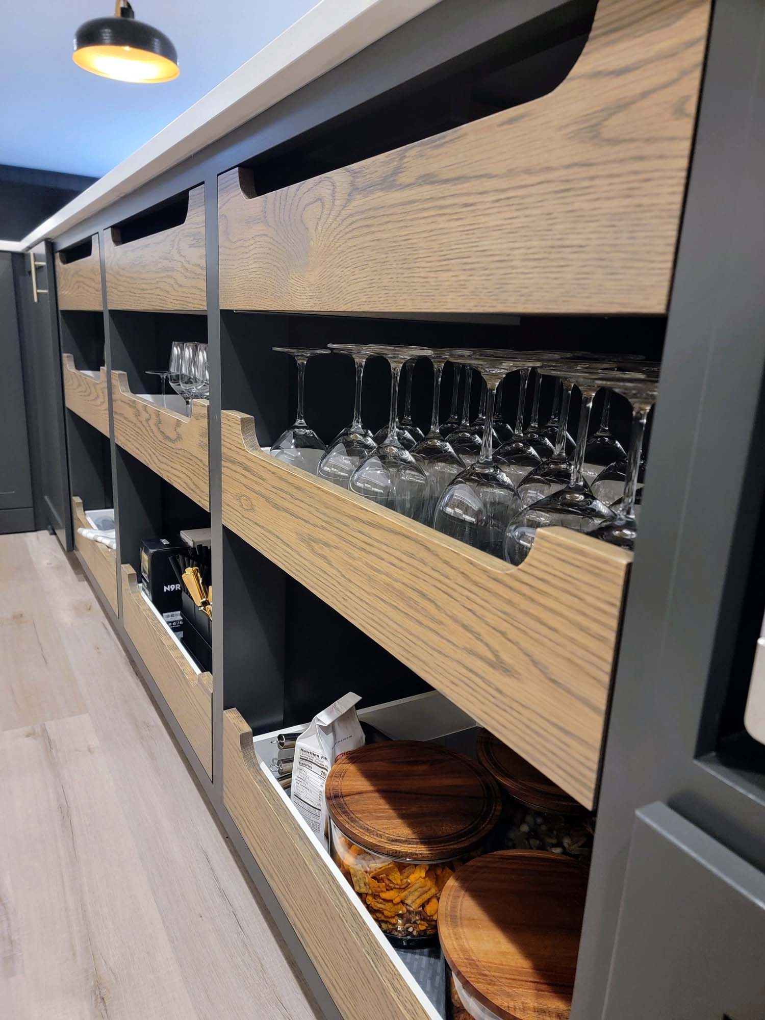 Custom rollout drawers for glassware and bar supplies