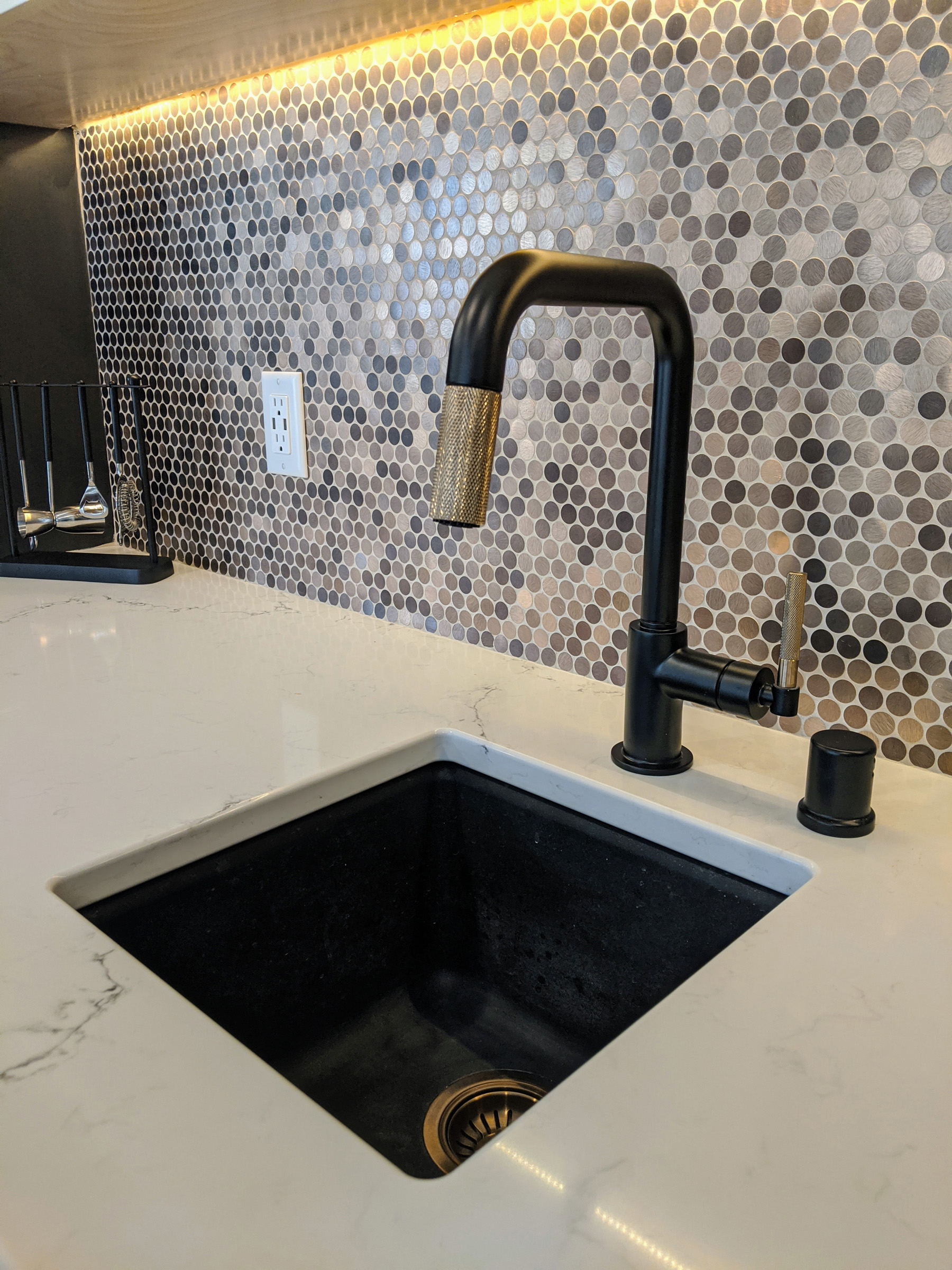 Quartz counters with Black granite sink, Black faucet w/ Champagne accents