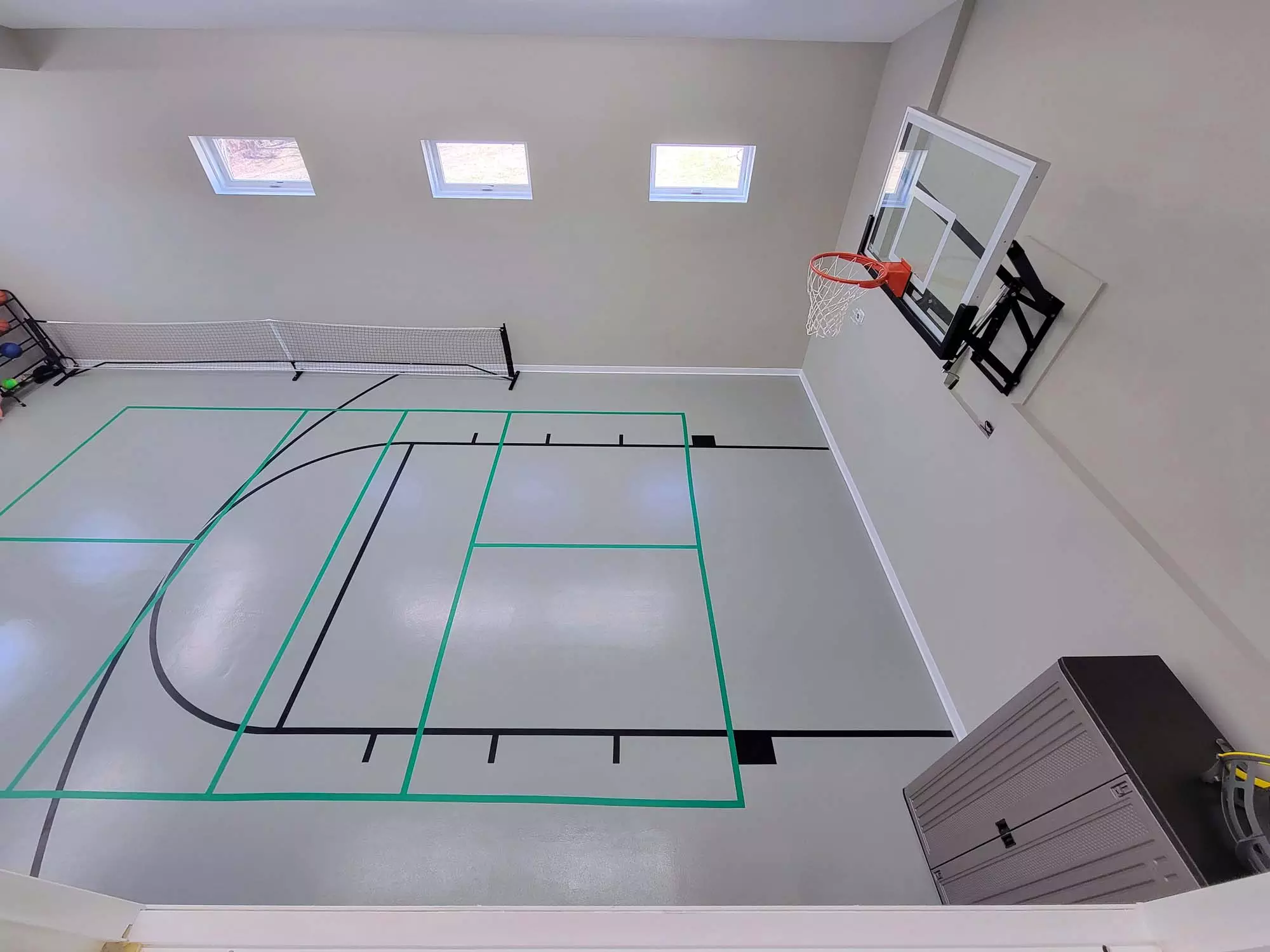 Floor is striped for multiple games - Basketball, Pickleball, Dodgeball