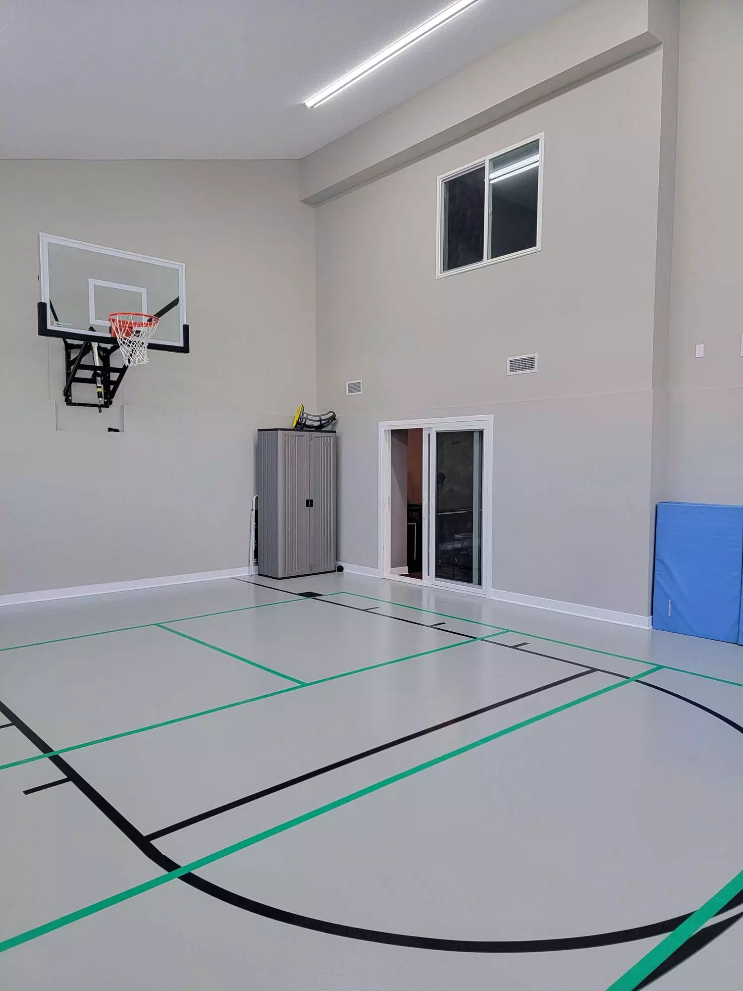 Indoor Sports Room® Slider Door Access and Gallery Overlook Window