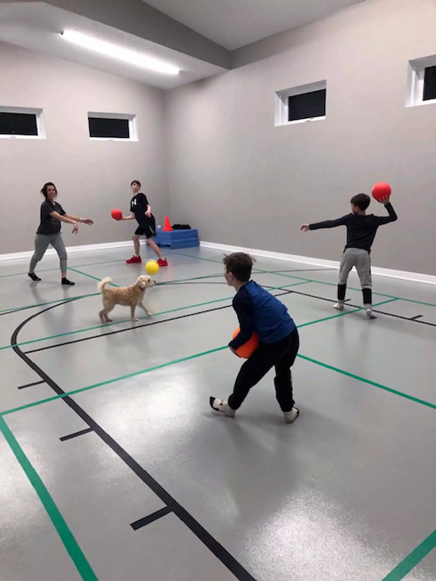 Kids and Dog Playing in Indoor Sports Room®
