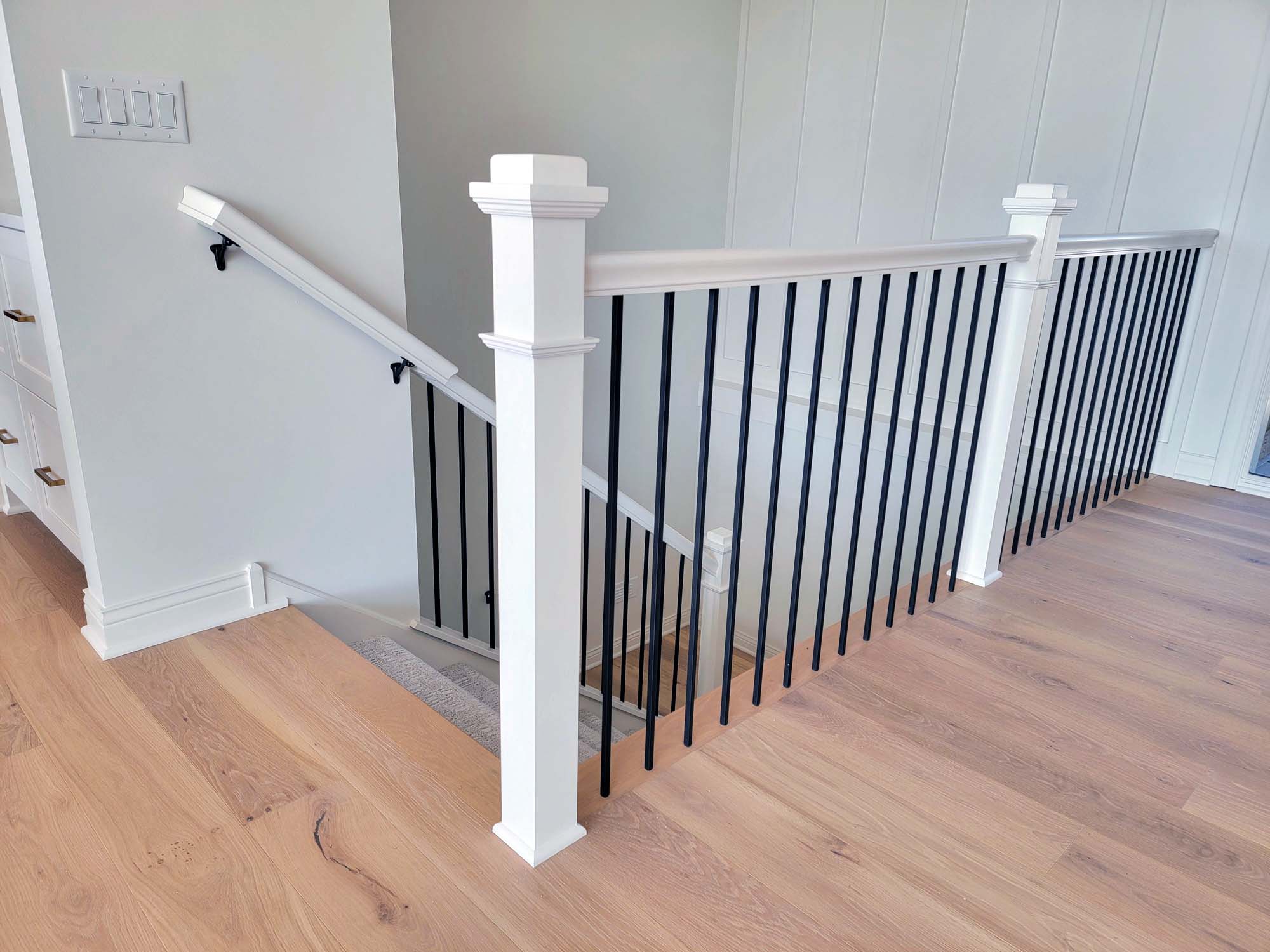 White enameled balusters and handrails with black spindles