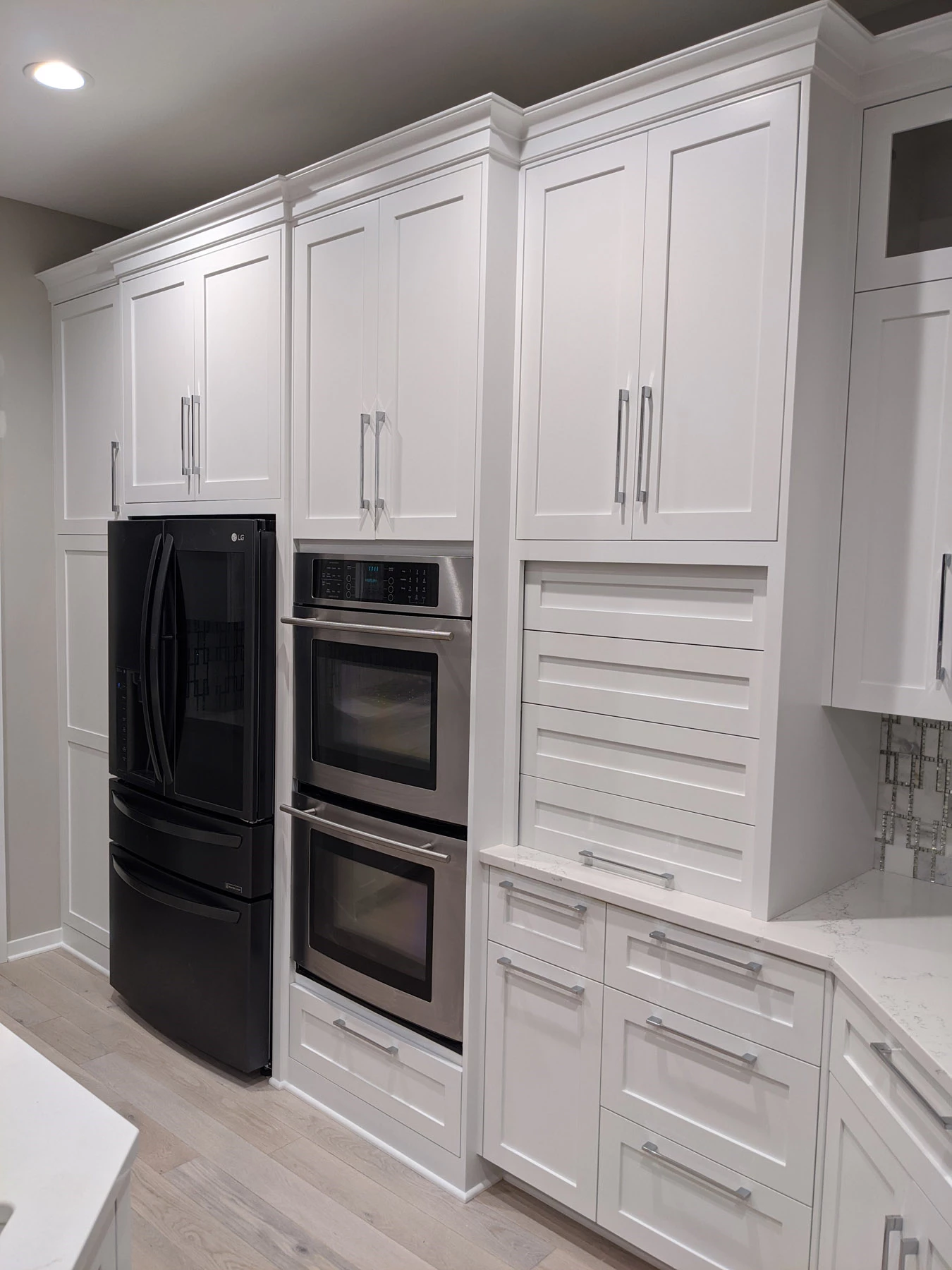 Contast Dark Appliances with White Cabinets